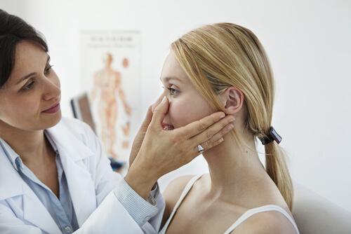 sinus doctor assessing patient